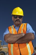 Portrait of construction worker on building site. Photo : Dan Bannister