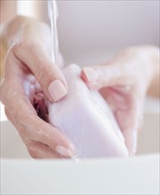 USA, New Jersey, Jersey City, Close-up view of woman washing hands. Photo : Jamie Grill Photography
