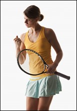 Young woman playing tennis winning. Photo : Mike Kemp