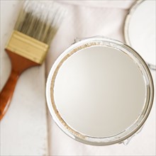 Close up of paint can and paint brush. Photo : Jamie Grill Photography