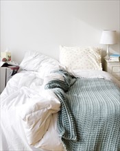 Messy bed in bedroom. Photo : Jamie Grill Photography
