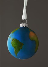 Studio Shot of Christmas ornament imitating globe. Photo : Mike Kemp