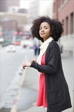 USA, Washington State, Seattle, young woman standing on street. Photo : Take A Pix Media