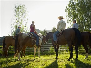 USA, Colorado, Family with teenage boy (14-15) riding horses on ranch. Photo : John Kelly