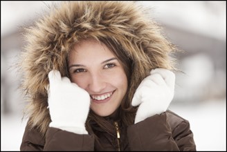 USA, Utah, Lehi, Portrait of young woman wearing fur hooded coat. Photo : Mike Kemp