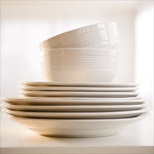 Close up of stack of dinnerware. Photo : Jamie Grill Photography