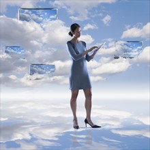 Digital composite of woman and cloudscape.