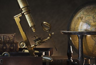 Old microscope and globe.