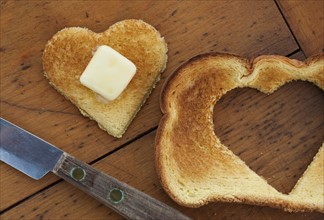 Heart shaped toast on table.