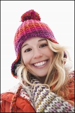 Portrait of young woman wearing winter clothes outdoors. Photo : Mike Kemp