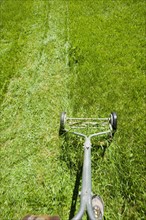USA, California, Point Reyes, Old fashioned mower on lawn. Photo : Noah Clayton