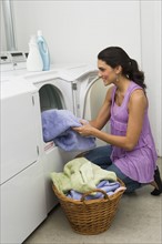 Woman doing laundry.
