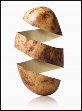 Potato peel in potato shape, studio shot. Photo : Mike Kemp