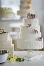 Wedding cake on cake stand.