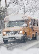 USA, New Jersey, Jersey City, school bus on road during blizzard. Photo : Jamie Grill Photography