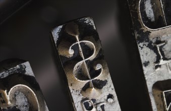 Close up of dollar sign on typewriter key.