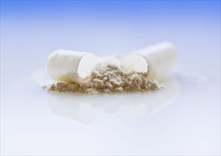 Close up of broken drug capsule.