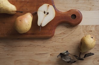 Close up of pears on cutting board.