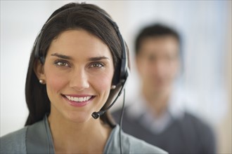 Portrait of female customer service representative.