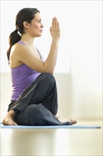 Young woman meditation in lotus position.