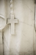 USA, Maryland, close up of cross on statue. Photo : Chris Hackett