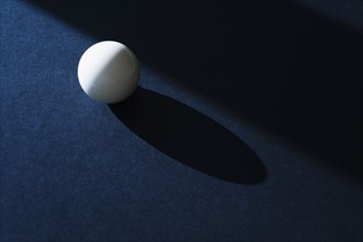 Cue ball on pool table.