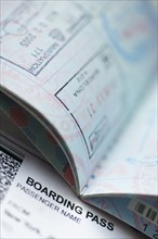 Passport with boarding pass inside.