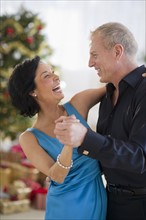 Happy mature couple dancing.