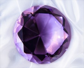 Studio shot of purple gem. Photo : Joe Clark