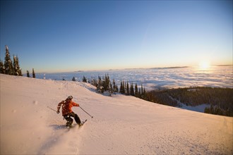 USA, Montana, Whitefish, Mid adult man skiing. Photo : Noah Clayton