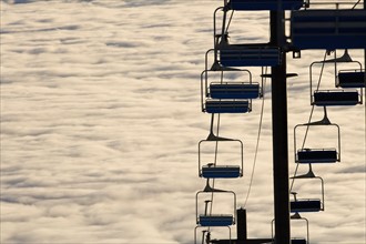 USA, Montana, Whitefish, Ski lift against clouds. Photo : Noah Clayton