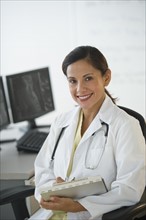 Portrait of smiling female doctor.