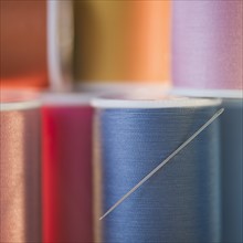 Spools with colorful threads. Photo : Jamie Grill Photography