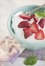 Studio shot of yogurt with strawberries. Photo: Jamie Grill Photography