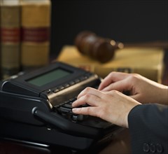 Court stenographer using stenograph machine. Photo : Daniel Grill
