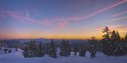 USA, Oregon, Snow covered field with Mount Jefferson in background, sunset. Photo: Gary Weathers
