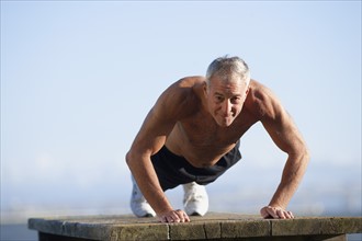 USA, California, Berkeley, Senior man exercising. Photo: Noah Clayton