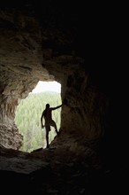 USA, Montana, Smith River, Young man in cave. Photo: Noah Clayton