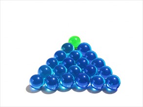 Blue glass balls and green one on the top. Photo : David Arky