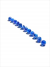 Blue glass balls in a row. Photo: David Arky