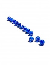 Blue glass balls in a row. Photo : David Arky