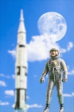 Figurine of astronaut with rocket in background. Photo : Antonio M. Rosario