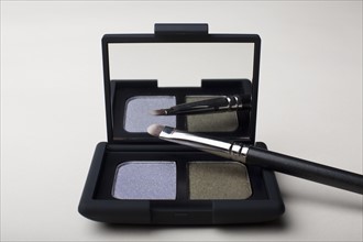 Powder compact with small brush. Photo: Winslow Productions