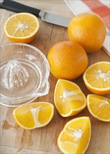Sliced oranges on chopping board.