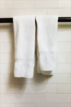White towels on towel bar.