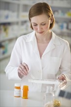 Pharmacist preparing medicine.