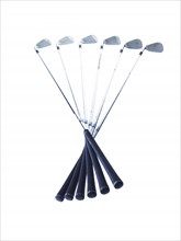 Golf clubs on white background. Photo : David Arky