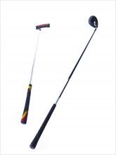 Two golf clubs on white background. Photo: David Arky
