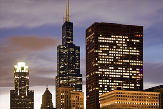 USA, Illinois, Chicago, Illuminated skyscrapers at dusk. Photo: Henryk Sadura
