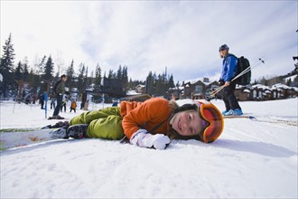 USA, Montana, Whitefish, Girl (8-9) skiing with her mother. Photo: Noah Clayton